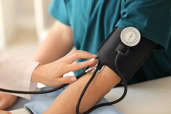 Man having blood pressure check