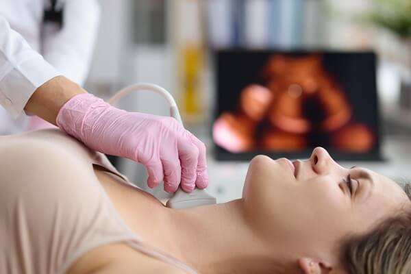 Woman getting her thyroid checked