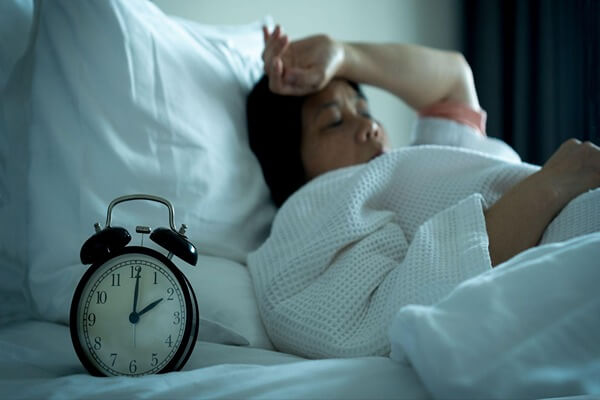 Woman laying in bed