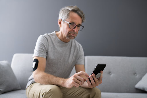 man looking at sugar level results