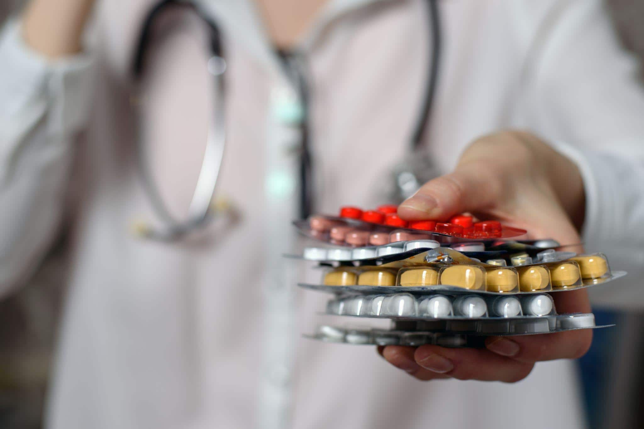 doctor holding Esomeprazole pills