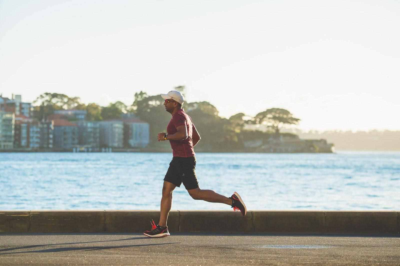 man jogging by the beach